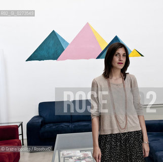 Rossella Farinotti, art critic and organizer of Arte in Sarpi in Milan, behind her a painting of Thomas Berra ©Grazia Ippolito/Rosebud2