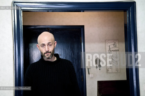Emanuele Santi, italian writer author ofIl portiere e lo stranieropublished byLAsino doro and contibutor of left magazine as a soccer s expert, pictured in his house in Rome ©Grazia Ippolito/Rosebud2
