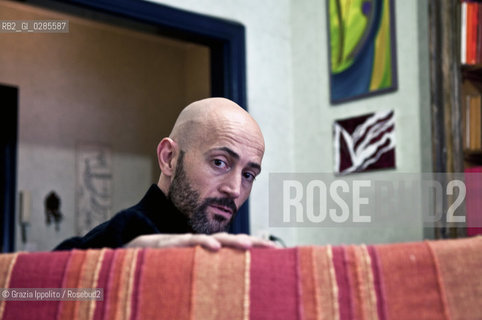Emanuele Santi, italian writer author ofIl portiere e lo stranieropublished byLAsino doro and contibutor of left magazine as a soccer s expert, pictured in his house in Rome ©Grazia Ippolito/Rosebud2