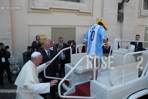 Rome, Vatican City, Pope Francis with a boy with a disability on the papal jeep, june 19, 2013. ©FotografiaFelici/Rosebud2