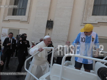 Rome, Vatican City, Pope Francis with a boy with a disability on the papal jeep, june 19, 2013. ©FotografiaFelici/Rosebud2