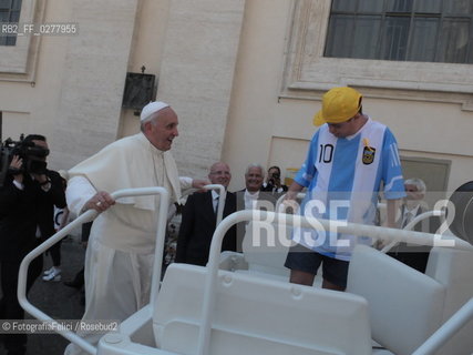 Rome, Vatican City, Pope Francis with a boy with a disability on the papal jeep, june 19, 2013. ©FotografiaFelici/Rosebud2