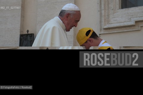 Rome, Vatican City, Pope Francis with a boy with a disability on the papal jeep, june 19, 2013. ©FotografiaFelici/Rosebud2