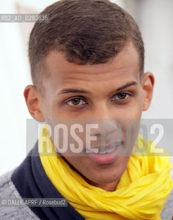 2011.07.15 - Stromae, de son vrai nom Paul Van Haver est un auteur compositeur interprete belge dorigine rwandaise. Il sillustre autant dans le hip-hop que dans la musique electronique en passant par la chanson francaise. Photo prise lors de son concert aux Vieilles Charrues 2011.. ©DALLE APRF/Rosebud2