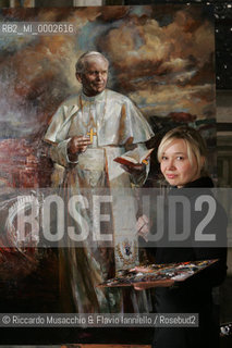 Rome, Santa Maria del Popolo Nov 22  2006.Portrait of the artist  Natalia Tsarkova with her painting of Pope Giovanni Paolo II and in the background, the Pinturicchio frescos in chapels..  ©Riccardo Musacchio & Flavio Ianniello/Rosebud2