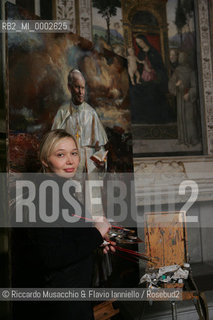 Rome, Santa Maria del Popolo Nov 22  2006.Portrait of the artist  Natalia Tsarkova with her painting of Pope Giovanni Paolo II and in the background, the Pinturicchio frescos in chapels..  ©Riccardo Musacchio & Flavio Ianniello/Rosebud2