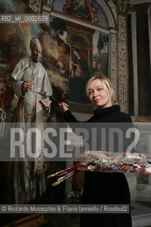 Rome, Santa Maria del Popolo Nov 22  2006.Portrait of the artist  Natalia Tsarkova with her painting of Pope Giovanni Paolo II and in the background, the Pinturicchio frescos in chapels..  ©Riccardo Musacchio & Flavio Ianniello/Rosebud2