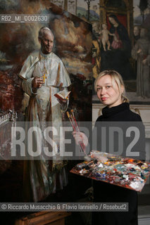 Rome, Santa Maria del Popolo Nov 22  2006.Portrait of the artist  Natalia Tsarkova with her painting of Pope Giovanni Paolo II and in the background, the Pinturicchio frescos in chapels..  ©Riccardo Musacchio & Flavio Ianniello/Rosebud2