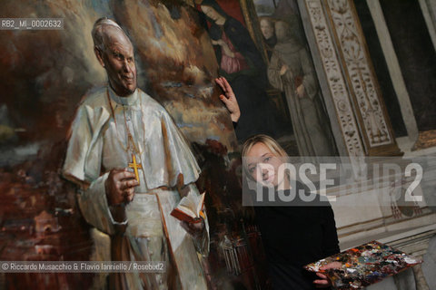 Rome, Santa Maria del Popolo Nov 22  2006.Portrait of the artist  Natalia Tsarkova with her painting of Pope Giovanni Paolo II and in the background, the Pinturicchio frescos in chapels..  ©Riccardo Musacchio & Flavio Ianniello/Rosebud2