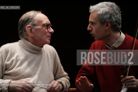 Feb 24 2006 Rome, Auditorium.National Santa Cecilia Orchestra and Choir.Conductor Ennio Morricone.In the picture: Ennio Morricone and Marco Fiorini (first violin of orchestra).  ©Riccardo Musacchio & Flavio Ianniello/Rosebud2