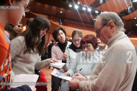 Feb 24 2006 Rome, Auditorium.National Santa Cecilia Orchestra and Choir.Conductor Ennio Morricone.In the picture: Ennio Morricone sign autograph.  ©Riccardo Musacchio & Flavio Ianniello/Rosebud2