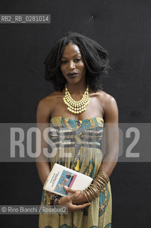 Rome September 9, 2013..Taiye Selasi, writer and photographer, photographed at the Casa delle Letterature of Rome, is half Nigerian, half Ghanaian, born in London and raised in Boston, and now lives in Rome, recently named among Granta 20 Young British Novelists and with the approval of postcolonial literary icons such as Toni Morrison, Salman Rushdie, Havana is regarded as the new voice of African literature in the Renaissance/Taiye Selasi, scrittrice e fotografa,  ritratta alla Casa delle Letterature di Roma Capitale, è metà ghanese e metà nigeriana, nata a Londra e cresciuta a Boston, ed ora vive a Roma, di recente nominata tra i 20 Granta Young British Novelists e con l’approvazione di vere icone della letteratura postcoloniale quali Toni Morrison e Salman Rushdie, Selasi è considerata come la nuova voce della letteratura africana in rinascita. .Photo: RINO BIANCHI ©Rino Bianchi/Rosebud2