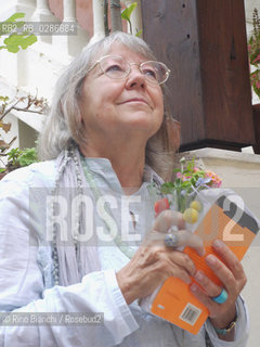 Rome October 16, 2010..Vivian Lamarque, photographed in Rome, poet, writer of fairy tales, collaborator of Corriere della Sera, nine months changed cities and family, at the age of four he lost his second father, ten discovered to have two mothers and wrote his first poems. From the age of nine months living in Milan, where he taught for many years. He translated Valéry, Baudelaire, Prévert, La Fontaine, Céline, Grimm and Wilde. He won the Viareggio Prize in 1980 for the first work. He published, besides Teresino, The Golden Lord, the Lord of frightened and poems giving of yourself. Of 1996 is a quiet dust. She is the author of 15 books of fairy tales and won the Rodari (1997) and the Andersen Prize (2000)..Vivian Lamarque, fotografata a Roma, poetessa, scrittrice di fiabe, collaboratrice del Corriere della Sera,  A nove mesi cambiò città e famiglia, a quattro anni perse il secondo padre, a dieci scoprì di avere due madri e scrisse le prime poesie. Dalletà di nove mesi vive a Milano, dove ha insegnato per molti anni. Ha tradotto Valéry, Baudelaire, Prévert, La Fontaine, Céline, Grimm e Wilde. Ha vinto nel 1980 il Premio Viareggio Opera Prima. Ha pubblicato, oltre a Teresino,  Il Signore doro, Il Signore degli spaventati e Poesie dando del Lei. Del 1996 è Una quieta polvere. È autrice di 15 libri di fiabe e ha vinto il Premio Rodari (1997) e il Premio Andersen (2000). .Photo: RINO BIANCHI ©Rino Bianchi/Rosebud2