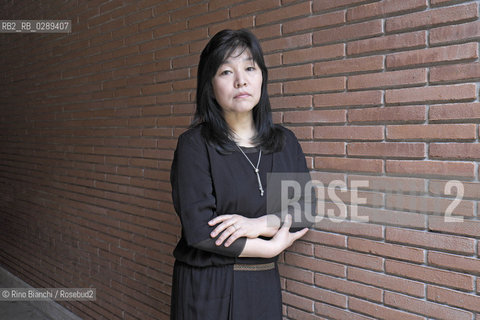 RomeMarch 15, 2014..Kyung-sook Shin photographed in Rome, Korean writer originally from a remote mountainous region of South Korea. He debuted as a writer in 1985 and is considered one of the most widely read Korean writers and celebrate. The novel take care of she got a great international success and has been published in thirty-two countries. In 2012, won the Man Asian Literary Prize, first Korean author in the history of the prize/Kyung-sook Shin fotografata a Roma, scrittrice coreana originaria di una remota regione montuosa della Corea del Sud. Ha esordito come scrittrice nel 1985  ed è considerata una delle scrittrici coreane più lette e celebrate. Il romanzo Prenditi cura di lei ha ottenuto un grande successo internazionale ed è stato pubblicato in trentadue paesi. Nel 2012 ha vinto il Man Asian Literary Prize, prima autrice coreana nella storia del premio..Photo: RINO BIANCHI ©Rino Bianchi/Rosebud2