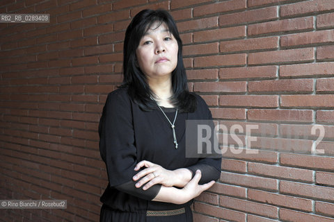 Rome March 15, 2014..Kyung-sook Shin photographed in Rome, Korean writer originally from a remote mountainous region of South Korea. He debuted as a writer in 1985 and is considered one of the most widely read Korean writers and celebrate. The novel take care of she got a great international success and has been published in thirty-two countries. In 2012, won the Man Asian Literary Prize, first Korean author in the history of the prize/Kyung-sook Shin fotografata a Roma, scrittrice coreana originaria di una remota regione montuosa della Corea del Sud. Ha esordito come scrittrice nel 1985  ed è considerata una delle scrittrici coreane più lette e celebrate. Il romanzo Prenditi cura di lei ha ottenuto un grande successo internazionale ed è stato pubblicato in trentadue paesi. Nel 2012 ha vinto il Man Asian Literary Prize, prima autrice coreana nella storia del premio..Photo: RINO BIANCHI ©Rino Bianchi/Rosebud2