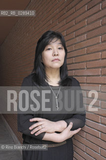 Rome March 15, 2014..Kyung-sook Shin photographed in Rome, Korean writer originally from a remote mountainous region of South Korea. He debuted as a writer in 1985 and is considered one of the most widely read Korean writers and celebrate. The novel take care of she got a great international success and has been published in thirty-two countries. In 2012, won the Man Asian Literary Prize, first Korean author in the history of the prize/Kyung-sook Shin fotografata a Roma, scrittrice coreana originaria di una remota regione montuosa della Corea del Sud. Ha esordito come scrittrice nel 1985  ed è considerata una delle scrittrici coreane più lette e celebrate. Il romanzo Prenditi cura di lei ha ottenuto un grande successo internazionale ed è stato pubblicato in trentadue paesi. Nel 2012 ha vinto il Man Asian Literary Prize, prima autrice coreana nella storia del premio..Photo: RINO BIANCHI ©Rino Bianchi/Rosebud2