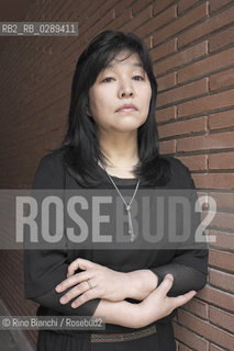 Rome March 15, 2014..Kyung-sook Shin photographed in Rome, Korean writer originally from a remote mountainous region of South Korea. He debuted as a writer in 1985 and is considered one of the most widely read Korean writers and celebrate. The novel take care of she got a great international success and has been published in thirty-two countries. In 2012, won the Man Asian Literary Prize, first Korean author in the history of the prize/Kyung-sook Shin fotografata a Roma, scrittrice coreana originaria di una remota regione montuosa della Corea del Sud. Ha esordito come scrittrice nel 1985  ed è considerata una delle scrittrici coreane più lette e celebrate. Il romanzo Prenditi cura di lei ha ottenuto un grande successo internazionale ed è stato pubblicato in trentadue paesi. Nel 2012 ha vinto il Man Asian Literary Prize, prima autrice coreana nella storia del premio..Photo: RINO BIANCHI ©Rino Bianchi/Rosebud2