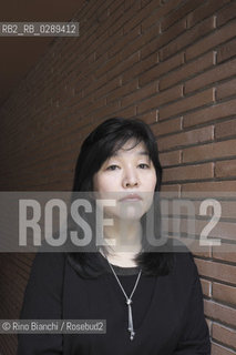 Rome March 15, 2014..Kyung-sook Shin photographed in Rome, Korean writer originally from a remote mountainous region of South Korea. He debuted as a writer in 1985 and is considered one of the most widely read Korean writers and celebrate. The novel take care of she got a great international success and has been published in thirty-two countries. In 2012, won the Man Asian Literary Prize, first Korean author in the history of the prize/Kyung-sook Shin fotografata a Roma, scrittrice coreana originaria di una remota regione montuosa della Corea del Sud. Ha esordito come scrittrice nel 1985  ed è considerata una delle scrittrici coreane più lette e celebrate. Il romanzo Prenditi cura di lei ha ottenuto un grande successo internazionale ed è stato pubblicato in trentadue paesi. Nel 2012 ha vinto il Man Asian Literary Prize, prima autrice coreana nella storia del premio..Photo: RINO BIANCHI ©Rino Bianchi/Rosebud2