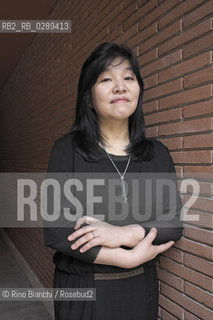 Rome March 15, 2014..Kyung-sook Shin photographed in Rome, Korean writer originally from a remote mountainous region of South Korea. He debuted as a writer in 1985 and is considered one of the most widely read Korean writers and celebrate. The novel take care of she got a great international success and has been published in thirty-two countries. In 2012, won the Man Asian Literary Prize, first Korean author in the history of the prize/Kyung-sook Shin fotografata a Roma, scrittrice coreana originaria di una remota regione montuosa della Corea del Sud. Ha esordito come scrittrice nel 1985  ed è considerata una delle scrittrici coreane più lette e celebrate. Il romanzo Prenditi cura di lei ha ottenuto un grande successo internazionale ed è stato pubblicato in trentadue paesi. Nel 2012 ha vinto il Man Asian Literary Prize, prima autrice coreana nella storia del premio..Photo: RINO BIANCHI ©Rino Bianchi/Rosebud2