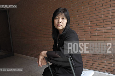 Rome March 15, 2014..Kyung-sook Shin photographed in Rome, Korean writer originally from a remote mountainous region of South Korea. He debuted as a writer in 1985 and is considered one of the most widely read Korean writers and celebrate. The novel take care of she got a great international success and has been published in thirty-two countries. In 2012, won the Man Asian Literary Prize, first Korean author in the history of the prize/Kyung-sook Shin fotografata a Roma, scrittrice coreana originaria di una remota regione montuosa della Corea del Sud. Ha esordito come scrittrice nel 1985  ed è considerata una delle scrittrici coreane più lette e celebrate. Il romanzo Prenditi cura di lei ha ottenuto un grande successo internazionale ed è stato pubblicato in trentadue paesi. Nel 2012 ha vinto il Man Asian Literary Prize, prima autrice coreana nella storia del premio..Photo: RINO BIANCHI ©Rino Bianchi/Rosebud2