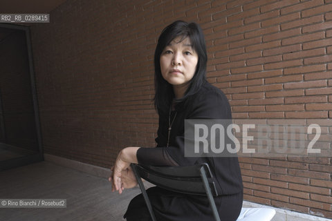 Rome March 15, 2014..Kyung-sook Shin photographed in Rome, Korean writer originally from a remote mountainous region of South Korea. He debuted as a writer in 1985 and is considered one of the most widely read Korean writers and celebrate. The novel take care of she got a great international success and has been published in thirty-two countries. In 2012, won the Man Asian Literary Prize, first Korean author in the history of the prize/Kyung-sook Shin fotografata a Roma, scrittrice coreana originaria di una remota regione montuosa della Corea del Sud. Ha esordito come scrittrice nel 1985  ed è considerata una delle scrittrici coreane più lette e celebrate. Il romanzo Prenditi cura di lei ha ottenuto un grande successo internazionale ed è stato pubblicato in trentadue paesi. Nel 2012 ha vinto il Man Asian Literary Prize, prima autrice coreana nella storia del premio..Photo: RINO BIANCHI ©Rino Bianchi/Rosebud2