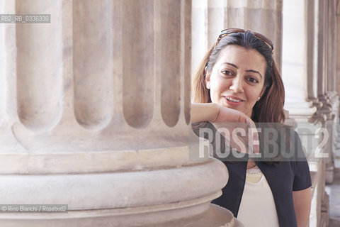 Rome June 10, 2015..Suha Oda, photographed in Rome in Piazza Colonna, reporter, journalist and human rights activist who fled from Mosul, occupied by the IS/Suha Oda, fotografata a Roma in piazza Colonna, reporter, giornalista e attivista per i diritti umani fuggita da Mosul, occupata dallIS..Photo: RINO BIANCHI ©Rino Bianchi/Rosebud2