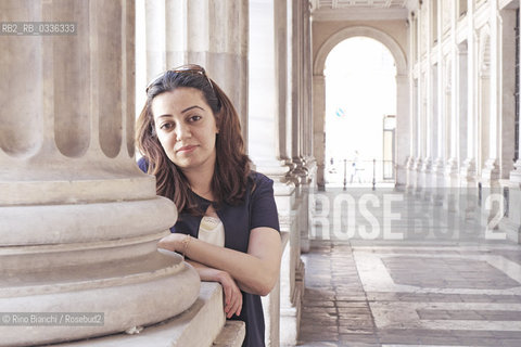 Rome June 10, 2015..Suha Oda, photographed in Rome in Piazza Colonna, reporter, journalist and human rights activist who fled from Mosul, occupied by the IS/Suha Oda, fotografata a Roma in piazza Colonna, reporter, giornalista e attivista per i diritti umani fuggita da Mosul, occupata dallIS..Photo: RINO BIANCHI ©Rino Bianchi/Rosebud2