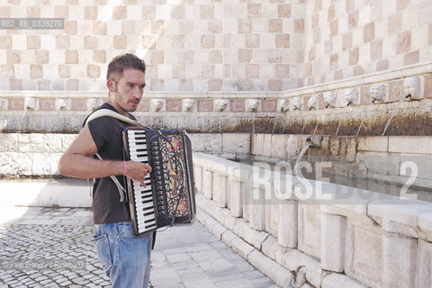 LAquila September 6, 2015..Il jazz italiano per LAquila..Carmine Ioanna, pianist and accordionist, born in Nusco, photographed the Fontana delle 99 cannelle./Carmine Ioanna, pianista e fisarmonicista, originario di Nusco, fotografato alla Fontana delle 99 cannelle..Photo: RINO BIANCHI ©Rino Bianchi/Rosebud2