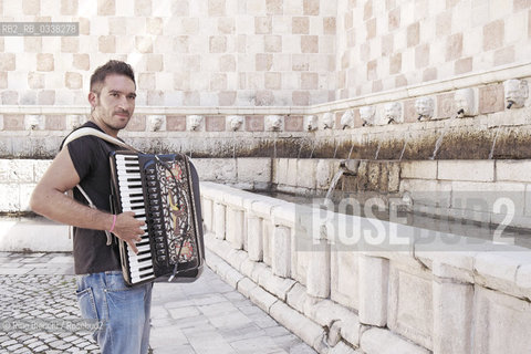 LAquila September 6, 2015..Il jazz italiano per LAquila..Carmine Ioanna, pianist and accordionist, born in Nusco, photographed the Fontana delle 99 cannelle./Carmine Ioanna, pianista e fisarmonicista, originario di Nusco, fotografato alla Fontana delle 99 cannelle..Photo: RINO BIANCHI ©Rino Bianchi/Rosebud2