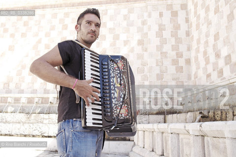 LAquila September 6, 2015..Il jazz italiano per LAquila..Carmine Ioanna, pianist and accordionist, born in Nusco, photographed the Fontana delle 99 cannelle./Carmine Ioanna, pianista e fisarmonicista, originario di Nusco, fotografato alla Fontana delle 99 cannelle..Photo: RINO BIANCHI ©Rino Bianchi/Rosebud2