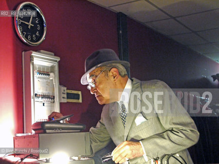 Rome June 3, 2010..Felix Picherna, photographed in Rome in a milonga in Torpignattara, and muzicalizador, disk jockey of the milonga. In Italy was the master of all and is due above all when it comes to muzicalizador-disc jockey. Globetrotter with the trolley, where they remain piled up the old cassette rewinding with two fingers/Felix Picherna, fotografato a Roma in una milonga a Torpignattara, el muzicalizador, disk jokey della milonga. In Italia é stato il maestro di tutti e gli é dovuta ogni precedenza quando si parla di muzicalizador-disc jockey. Giramondo con il trolley, dove restano ammucchiate le antiche cassette che riavvolge con due dita. .Photo: RINO BIANCHI ©Rino Bianchi/Rosebud2