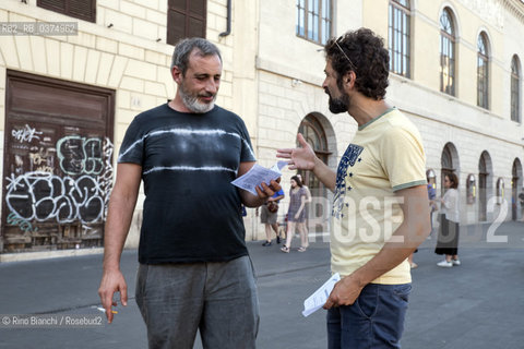 Rome July 4, 2018..Simone Nebbia with Fabrizio Arcuri photographed during the flash mob for the Nansen passport promoted by Italian writers and intellectuals to sensitize Italian public opinion on migratory flows and access to travel/Simone Nebbia con Fabrizio, fotografati durante il flash mob per il passaporto Nansen promosso da scrittori ed intellettuali italiani per sensibilizzare lopinione pubblica italiana sui flussi migratori e laccesso al viaggio. ©Rino Bianchi/Rosebud2