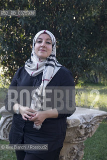 Rome September 23, 2018..Asmae Dachan, journalist, reporter, writer, Italian-Syrian human rights activist, winner of the Kapuscinski Award 2018, photographed in Rome in the park of Villa Celimontana/Asmae Dachan, giornalista, reporter, scrittrice, attivista per i diritti umani italo-siriana, vincitrice del Premio Kapuscinski 2018,  fotografata a Roma nel parco di Villa Celimontana. ©Rino Bianchi/Rosebud2