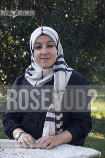 Rome September 23, 2018..Asmae Dachan, journalist, reporter, writer, Italian-Syrian human rights activist, winner of the Kapuscinski Award 2018, photographed in Rome in the park of Villa Celimontana/Asmae Dachan, giornalista, reporter, scrittrice, attivista per i diritti umani italo-siriana, vincitrice del Premio Kapuscinski 2018,  fotografata a Roma nel parco di Villa Celimontana. ©Rino Bianchi/Rosebud2