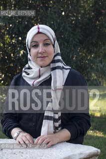 Rome September 23, 2018..Asmae Dachan, journalist, reporter, writer, Italian-Syrian human rights activist, winner of the Kapuscinski Award 2018, photographed in Rome in the park of Villa Celimontana/Asmae Dachan, giornalista, reporter, scrittrice, attivista per i diritti umani italo-siriana, vincitrice del Premio Kapuscinski 2018,  fotografata a Roma nel parco di Villa Celimontana. ©Rino Bianchi/Rosebud2