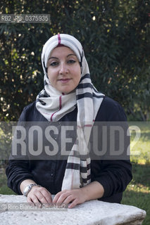 Rome September 23, 2018..Asmae Dachan, journalist, reporter, writer, Italian-Syrian human rights activist, winner of the Kapuscinski Award 2018, photographed in Rome in the park of Villa Celimontana/Asmae Dachan, giornalista, reporter, scrittrice, attivista per i diritti umani italo-siriana, vincitrice del Premio Kapuscinski 2018,  fotografata a Roma nel parco di Villa Celimontana. ©Rino Bianchi/Rosebud2