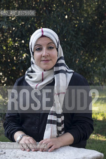 Rome September 23, 2018..Asmae Dachan, journalist, reporter, writer, Italian-Syrian human rights activist, winner of the Kapuscinski Award 2018, photographed in Rome in the park of Villa Celimontana/Asmae Dachan, giornalista, reporter, scrittrice, attivista per i diritti umani italo-siriana, vincitrice del Premio Kapuscinski 2018,  fotografata a Roma nel parco di Villa Celimontana. ©Rino Bianchi/Rosebud2