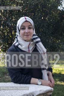 Rome September 23, 2018..Asmae Dachan, journalist, reporter, writer, Italian-Syrian human rights activist, winner of the Kapuscinski Award 2018, photographed in Rome in the park of Villa Celimontana/Asmae Dachan, giornalista, reporter, scrittrice, attivista per i diritti umani italo-siriana, vincitrice del Premio Kapuscinski 2018,  fotografata a Roma nel parco di Villa Celimontana. ©Rino Bianchi/Rosebud2