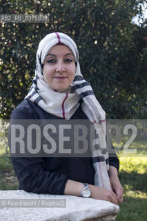 Rome September 23, 2018..Asmae Dachan, journalist, reporter, writer, Italian-Syrian human rights activist, winner of the Kapuscinski Award 2018, photographed in Rome in the park of Villa Celimontana/Asmae Dachan, giornalista, reporter, scrittrice, attivista per i diritti umani italo-siriana, vincitrice del Premio Kapuscinski 2018,  fotografata a Roma nel parco di Villa Celimontana. ©Rino Bianchi/Rosebud2