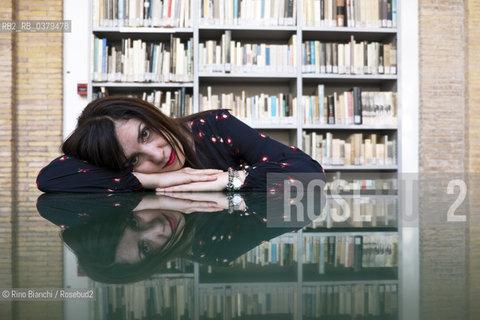 Rome May 20, 2019..Nadia Terranova, writer, collaborator of the newspapers Il del Sole 24 ore, La Repubblica, Internazionale and Il Foglio, photographed in Rome in the Casa delle Letterature spaces in front of the library of the Fondo Enzo Siciliano/Nadia Terranova, scrittrice, collaboratrice delle testate giornalistiche  IL del Sole 24 ore, La Repubblica, Internazionale e il Foglio, fotografata a Roma negli spazi della Casa delle Letterature davanti alla libreria del Fondo Enzo Siciliano. ©Rino Bianchi/Rosebud2