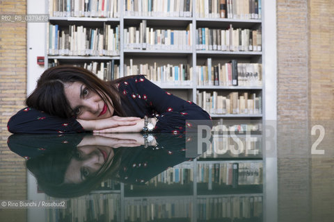 Rome May 20, 2019..Nadia Terranova, writer, collaborator of the newspapers Il del Sole 24 ore, La Repubblica, Internazionale and Il Foglio, photographed in Rome in the Casa delle Letterature spaces in front of the library of the Fondo Enzo Siciliano/Nadia Terranova, scrittrice, collaboratrice delle testate giornalistiche  IL del Sole 24 ore, La Repubblica, Internazionale e il Foglio, fotografata a Roma negli spazi della Casa delle Letterature davanti alla libreria del Fondo Enzo Siciliano. ©Rino Bianchi/Rosebud2