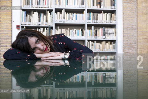 Rome May 20, 2019..Nadia Terranova, writer, collaborator of the newspapers Il del Sole 24 ore, La Repubblica, Internazionale and Il Foglio, photographed in Rome in the Casa delle Letterature spaces in front of the library of the Fondo Enzo Siciliano/Nadia Terranova, scrittrice, collaboratrice delle testate giornalistiche  IL del Sole 24 ore, La Repubblica, Internazionale e il Foglio, fotografata a Roma negli spazi della Casa delle Letterature davanti alla libreria del Fondo Enzo Siciliano. ©Rino Bianchi/Rosebud2