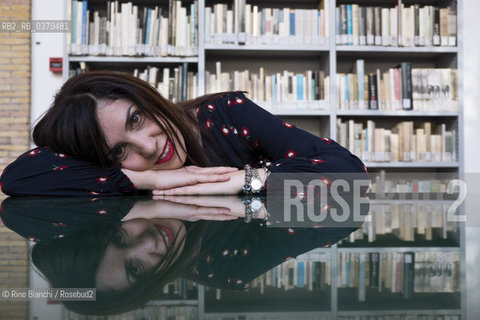 Rome May 20, 2019..Nadia Terranova, writer, collaborator of the newspapers Il del Sole 24 ore, La Repubblica, Internazionale and Il Foglio, photographed in Rome in the Casa delle Letterature spaces in front of the library of the Fondo Enzo Siciliano/Nadia Terranova, scrittrice, collaboratrice delle testate giornalistiche  IL del Sole 24 ore, La Repubblica, Internazionale e il Foglio, fotografata a Roma negli spazi della Casa delle Letterature davanti alla libreria del Fondo Enzo Siciliano. ©Rino Bianchi/Rosebud2