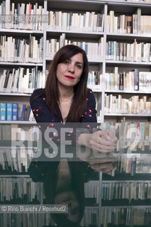 Rome May 20, 2019..Nadia Terranova, writer, collaborator of the newspapers Il del Sole 24 ore, La Repubblica, Internazionale and Il Foglio, photographed in Rome in the Casa delle Letterature spaces in front of the library of the Fondo Enzo Siciliano/Nadia Terranova, scrittrice, collaboratrice delle testate giornalistiche  IL del Sole 24 ore, La Repubblica, Internazionale e il Foglio, fotografata a Roma negli spazi della Casa delle Letterature davanti alla libreria del Fondo Enzo Siciliano. ©Rino Bianchi/Rosebud2