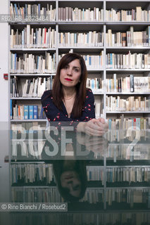 Rome May 20, 2019..Nadia Terranova, writer, collaborator of the newspapers Il del Sole 24 ore, La Repubblica, Internazionale and Il Foglio, photographed in Rome in the Casa delle Letterature spaces in front of the library of the Fondo Enzo Siciliano/Nadia Terranova, scrittrice, collaboratrice delle testate giornalistiche  IL del Sole 24 ore, La Repubblica, Internazionale e il Foglio, fotografata a Roma negli spazi della Casa delle Letterature davanti alla libreria del Fondo Enzo Siciliano. ©Rino Bianchi/Rosebud2