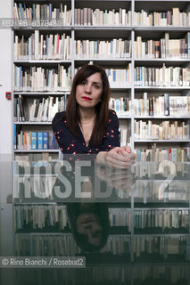 Rome May 20, 2019..Nadia Terranova, writer, collaborator of the newspapers Il del Sole 24 ore, La Repubblica, Internazionale and Il Foglio, photographed in Rome in the Casa delle Letterature spaces in front of the library of the Fondo Enzo Siciliano/Nadia Terranova, scrittrice, collaboratrice delle testate giornalistiche  IL del Sole 24 ore, La Repubblica, Internazionale e il Foglio, fotografata a Roma negli spazi della Casa delle Letterature davanti alla libreria del Fondo Enzo Siciliano. ©Rino Bianchi/Rosebud2