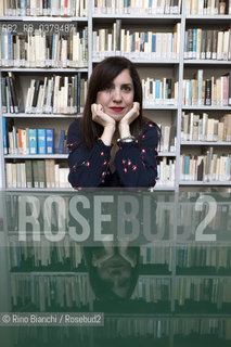 Rome May 20, 2019..Nadia Terranova, writer, collaborator of the newspapers Il del Sole 24 ore, La Repubblica, Internazionale and Il Foglio, photographed in Rome in the Casa delle Letterature spaces in front of the library of the Fondo Enzo Siciliano/Nadia Terranova, scrittrice, collaboratrice delle testate giornalistiche  IL del Sole 24 ore, La Repubblica, Internazionale e il Foglio, fotografata a Roma negli spazi della Casa delle Letterature davanti alla libreria del Fondo Enzo Siciliano. ©Rino Bianchi/Rosebud2