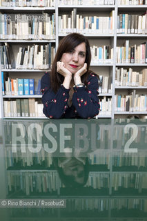 Rome May 20, 2019..Nadia Terranova, writer, collaborator of the newspapers Il del Sole 24 ore, La Repubblica, Internazionale and Il Foglio, photographed in Rome in the Casa delle Letterature spaces in front of the library of the Fondo Enzo Siciliano/Nadia Terranova, scrittrice, collaboratrice delle testate giornalistiche  IL del Sole 24 ore, La Repubblica, Internazionale e il Foglio, fotografata a Roma negli spazi della Casa delle Letterature davanti alla libreria del Fondo Enzo Siciliano. ©Rino Bianchi/Rosebud2