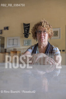 San Felice Circeo June 14, 2019..Tiziana Colusso, poet and essayist, photographed in San Felice Circeo in the room where memorabilia and memories of Elsa De Giorgi are kept/Tiziana Colusso, poetessa e saggista, fotografata a San Felice Circeo nella sala dove sono custoditi cimeli e ricordi di Elsa De Giorgi. ©Rino Bianchi/Rosebud2