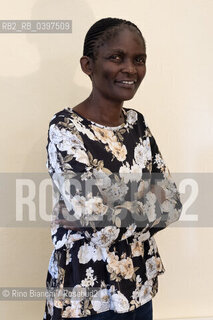 Vercelli october 26, 2023..Susan Nalugwa Kiguli, Ugandan poet and writer, associate professor of literature at the University of Makerere, supporter of creative writing in Africa, photographed in Vercelli in the main hall of the Lagrangia Classical High School during the Civil Poetry festival/Susan Nalugwa Kiguli poetessa e letterata ugandese, professore associato di letteratura presso lUniversità di Makerere, sostenitrice   della scrittura creativa in Africa, fotografata a Vercelli nellaula magna del Liceo Classico Lagrangia durante il festival di Poesia Civile. ©Rino Bianchi/Rosebud2